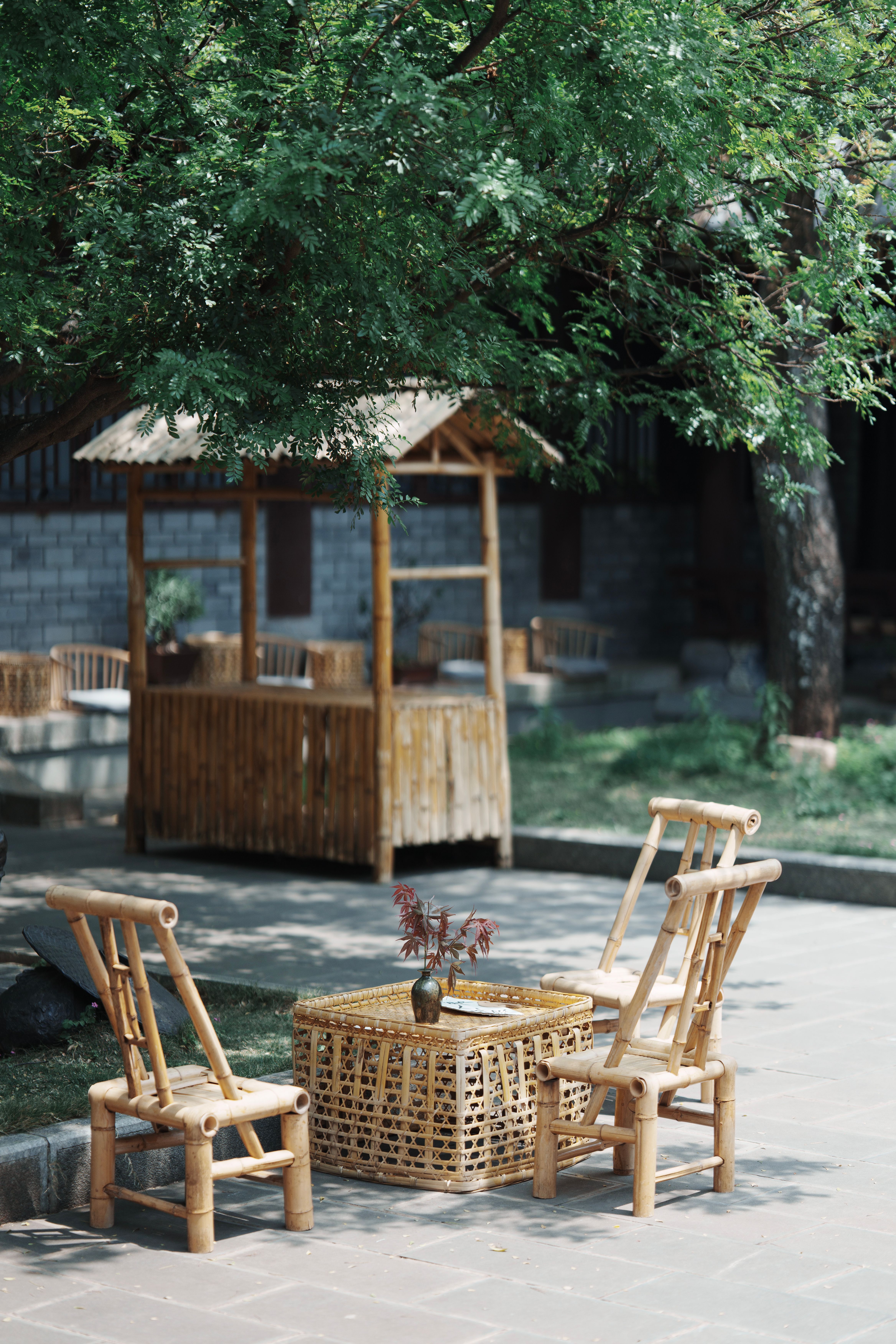 Minimal bamboo dining chair with a straight back and hand-woven bamboo seat panel